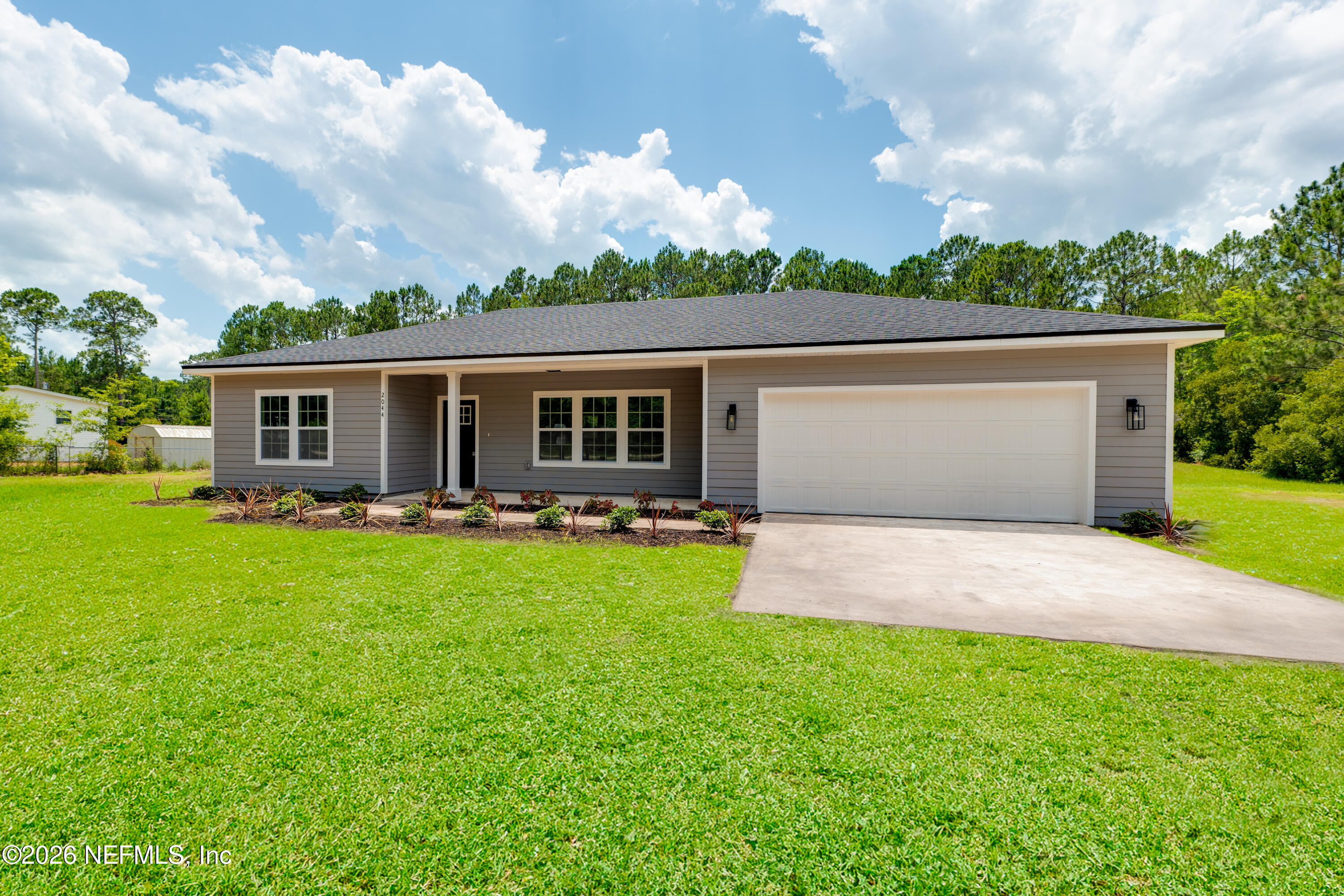 5573 Oregon Trail Middleburg, FL 32068 - Photo 2 of 26 front view of house with a yard