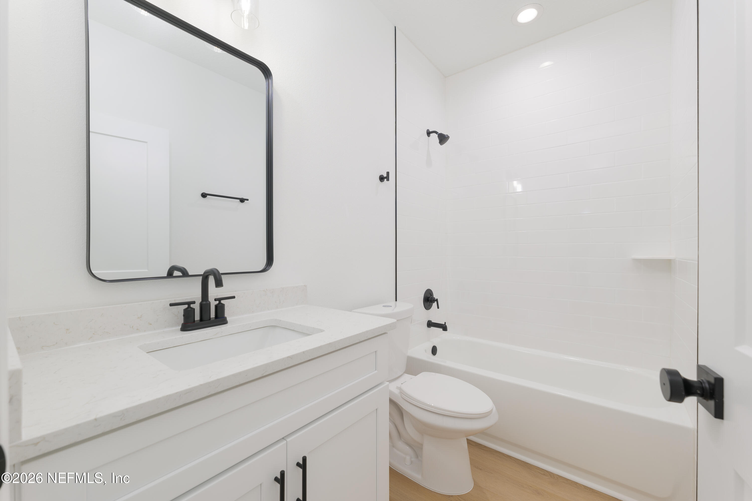 5573 Oregon Trail Middleburg, FL 32068 - Photo 21 of 26 a bathroom with a sink a toilet and a mirror