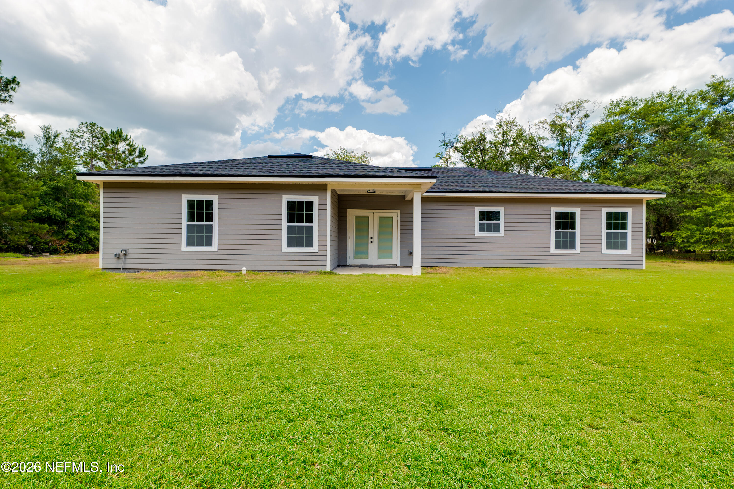 5573 Oregon Trail Middleburg, FL 32068 - Photo 25 of 26 a front view of house with yard and green space
