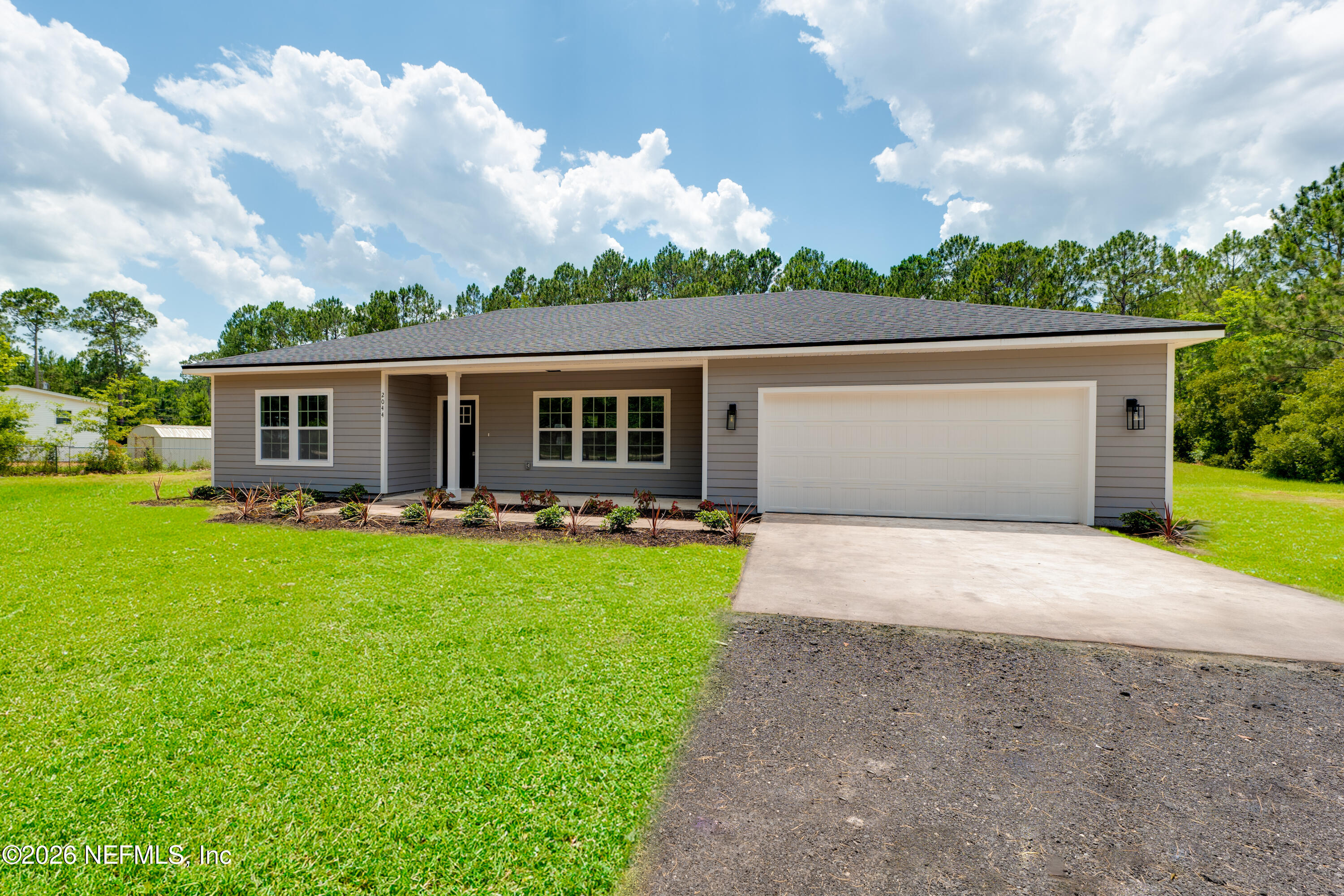 5573 Oregon Trail Middleburg, FL 32068 - Photo 3 of 26 a front view of house with yard and green space