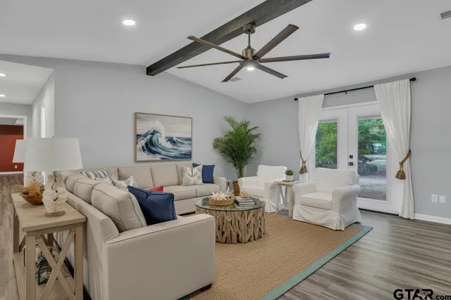 a living room with furniture and a large window