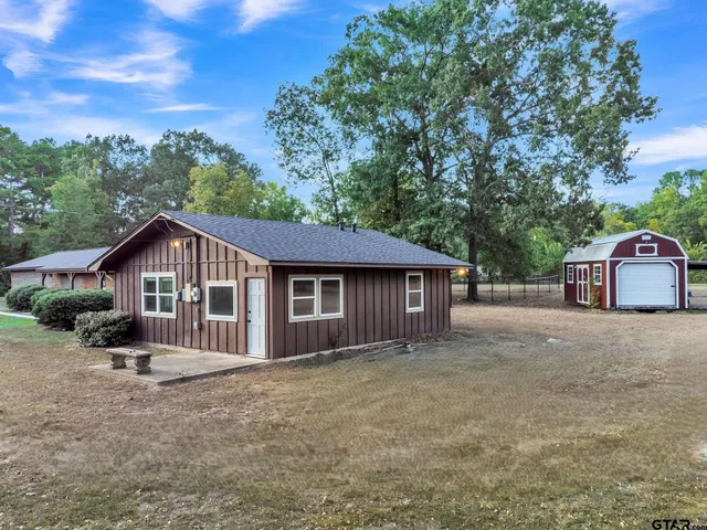a house with trees in the background