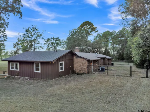 front view of a house with a trees