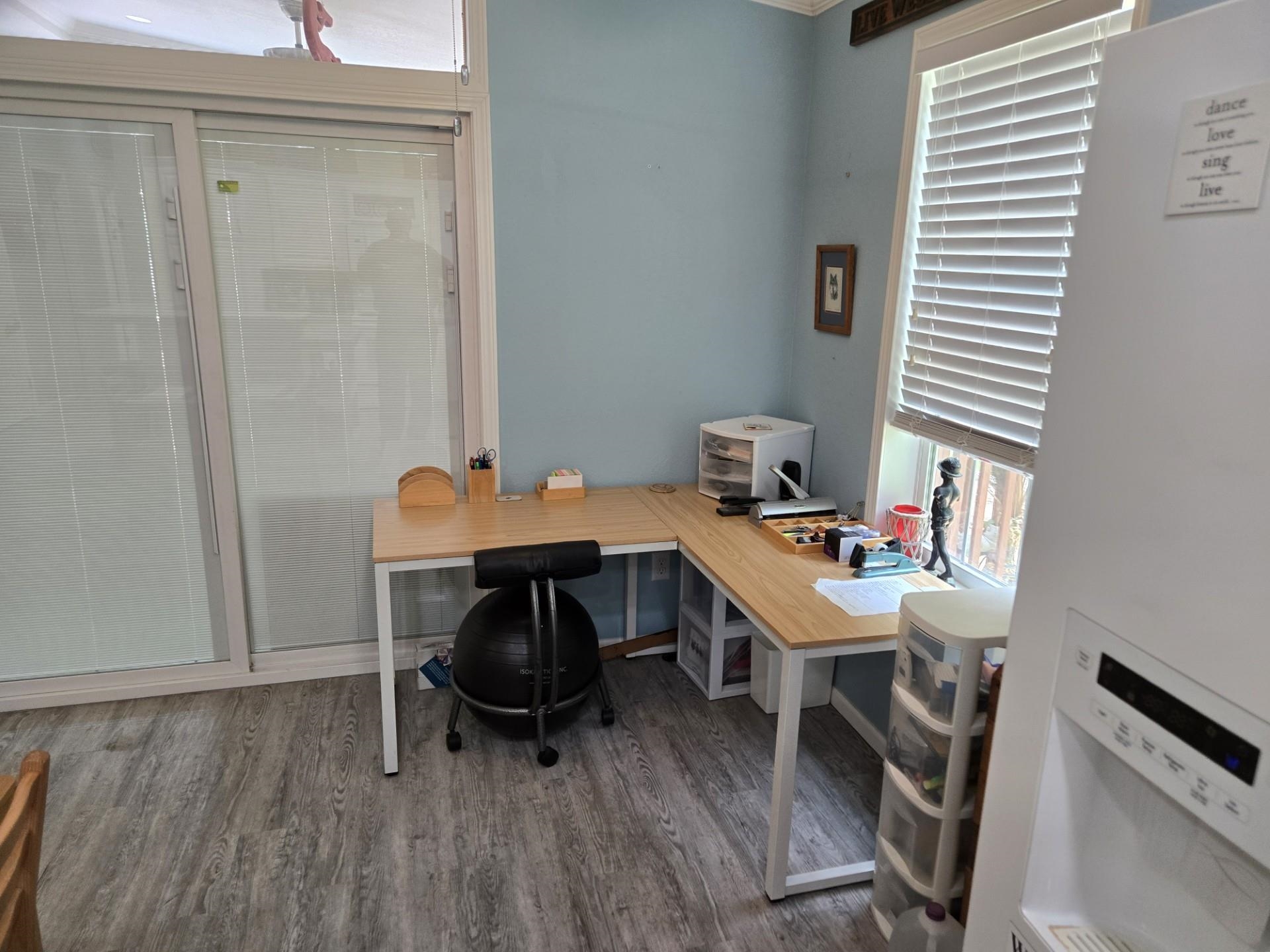 631 Andrew Avenue St. Augustine, FL 32086 - Photo 18 of 20 a view of a workspace with furniture and wooden floor