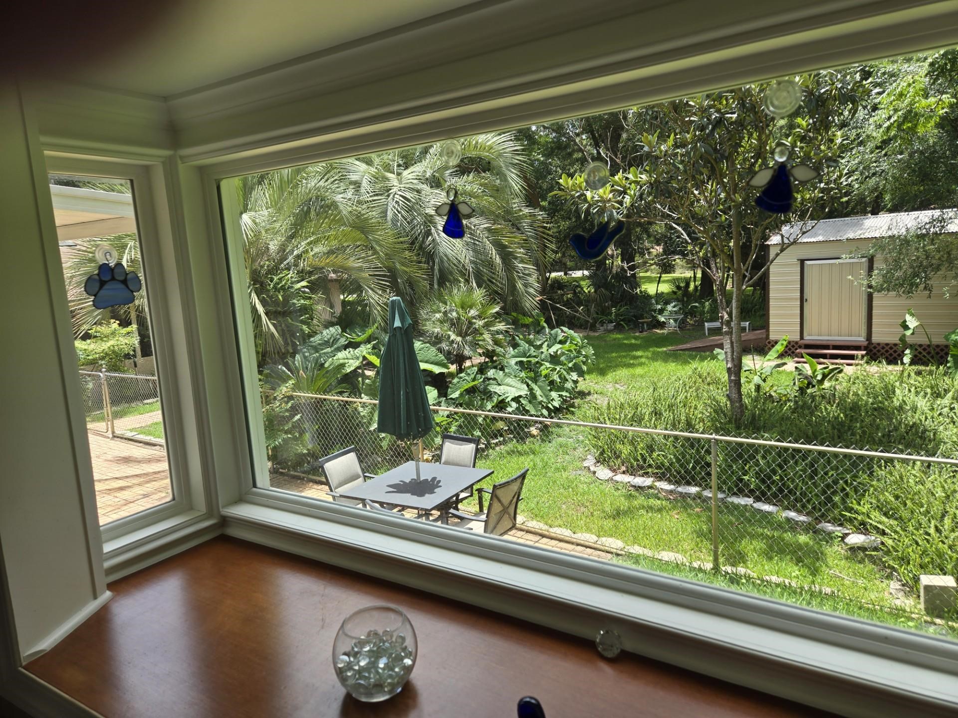 631 Andrew Avenue St. Augustine, FL 32086 - Photo 4 of 20 a view of backyard with green space and seating area