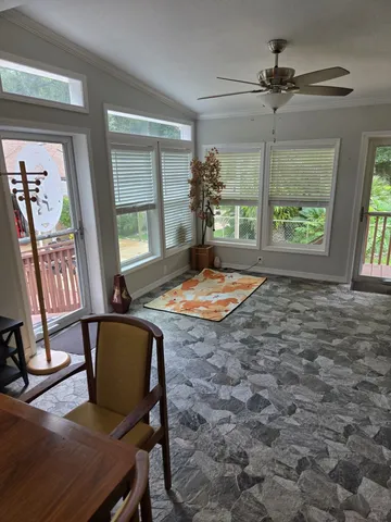 a view of a livingroom with furniture window and wooden floor
