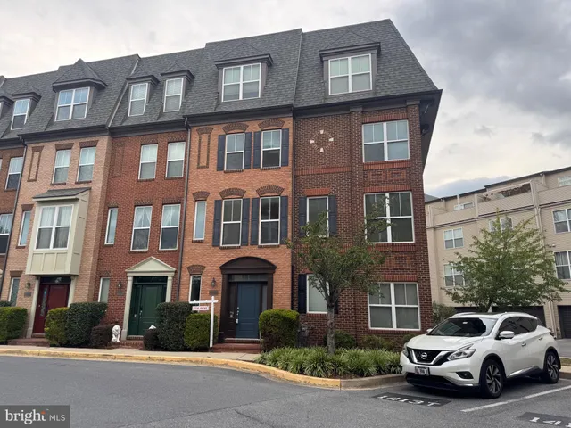 a car parked in front of a brick building
