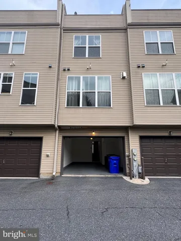 a front view of a house with a garage