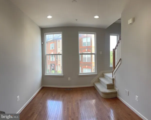 a room with window and wooden floor
