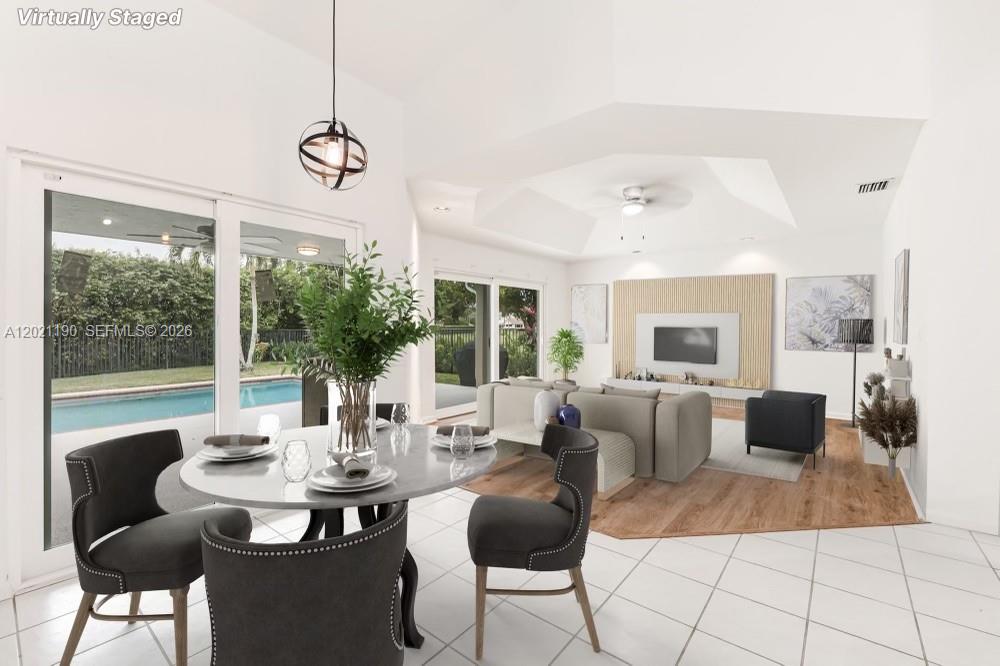 814 Heron Road Weston, FL 33326 - Photo 11 of 27 a view of a dining room with furniture window and outside view