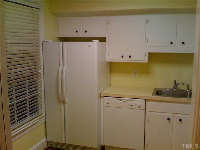 3421 Clark Avenue Raleigh, NC 27607 - Photo 9 of 19 a kitchen with a sink and cabinets