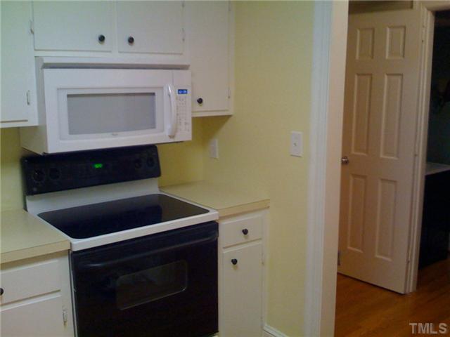 3421 Clark Avenue Raleigh, NC 27607 - Photo 10 of 19 a room with a stove and a microwave