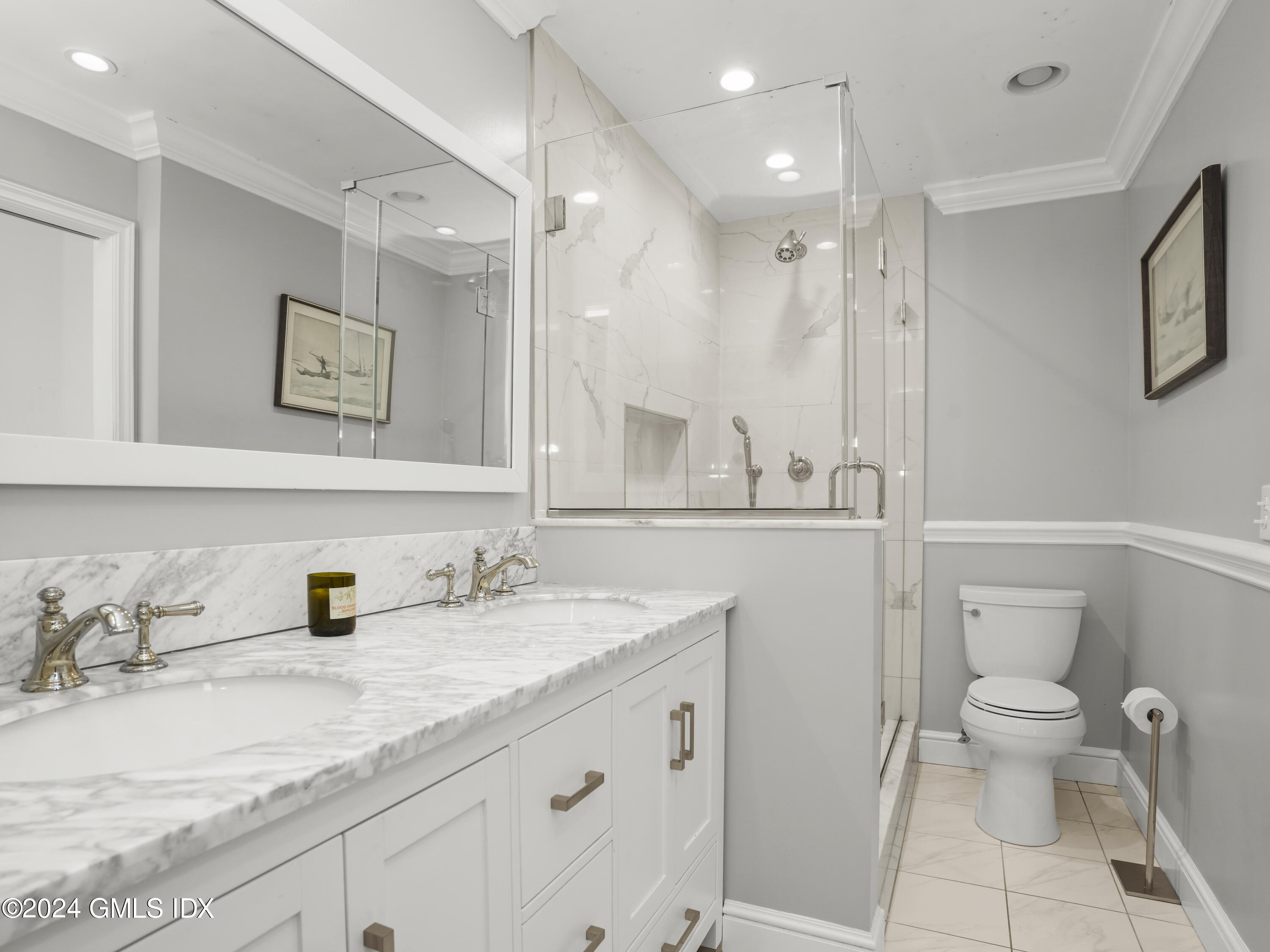 102 Silo Circle, Unit 102 Riverside, CT 06878 - Photo 12 of 22 a bathroom with a granite countertop sink a toilet and a mirror