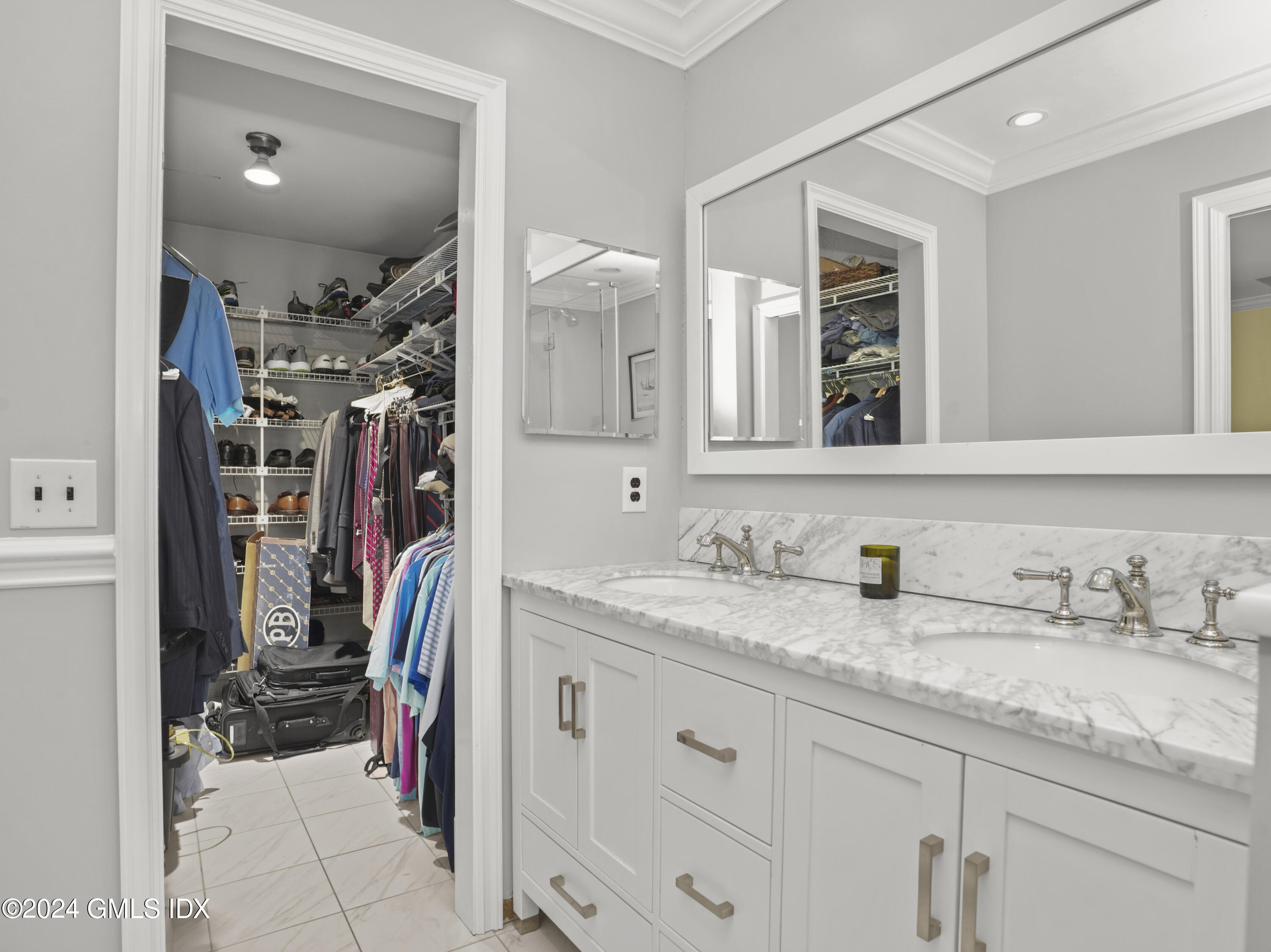 102 Silo Circle, Unit 102 Riverside, CT 06878 - Photo 13 of 22 a en suite bathroom with a granite countertop sink and a mirror