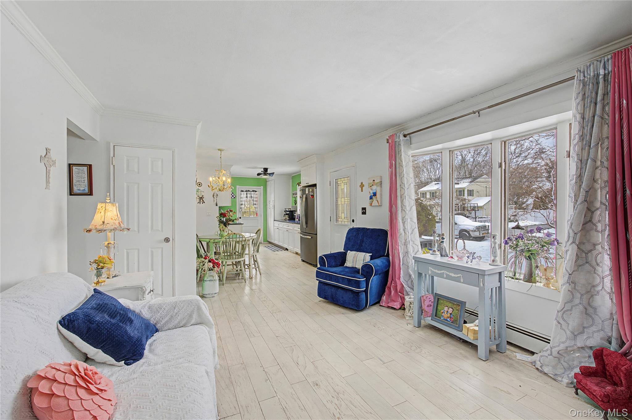 9 Amherst Road West Sayville, NY 11796 - Photo 12 of 22 a living room with furniture and a floor to ceiling window