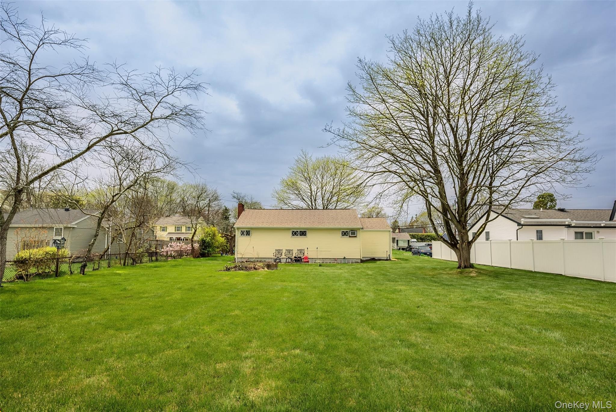 9 Amherst Road West Sayville, NY 11796 - Photo 18 of 22 a house view with garden in front of it