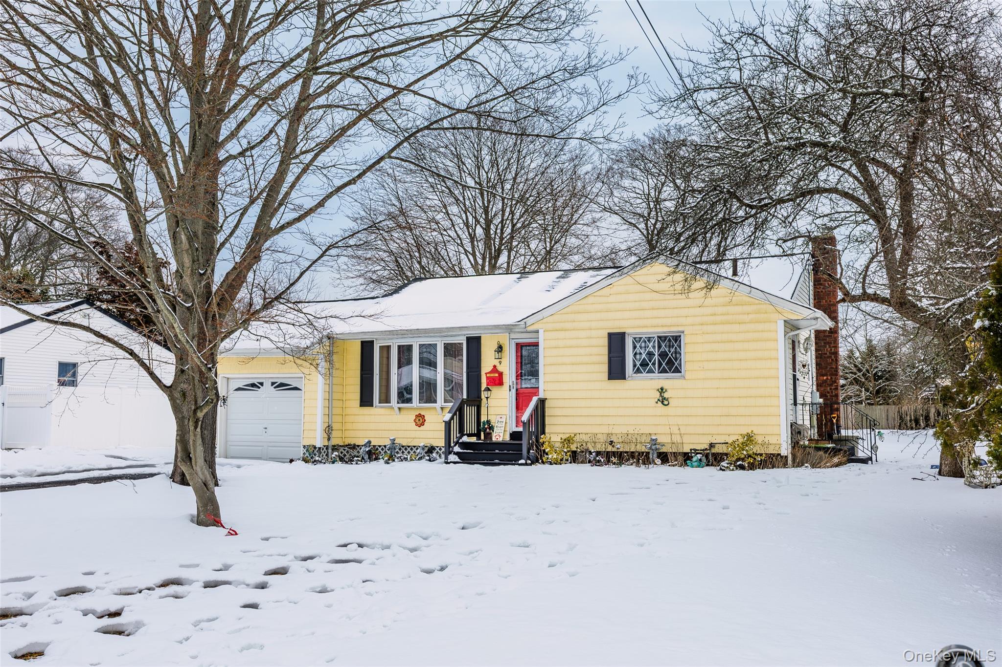 9 Amherst Road West Sayville, NY 11796 - Photo 19 of 22 a view of a house with snow on the road