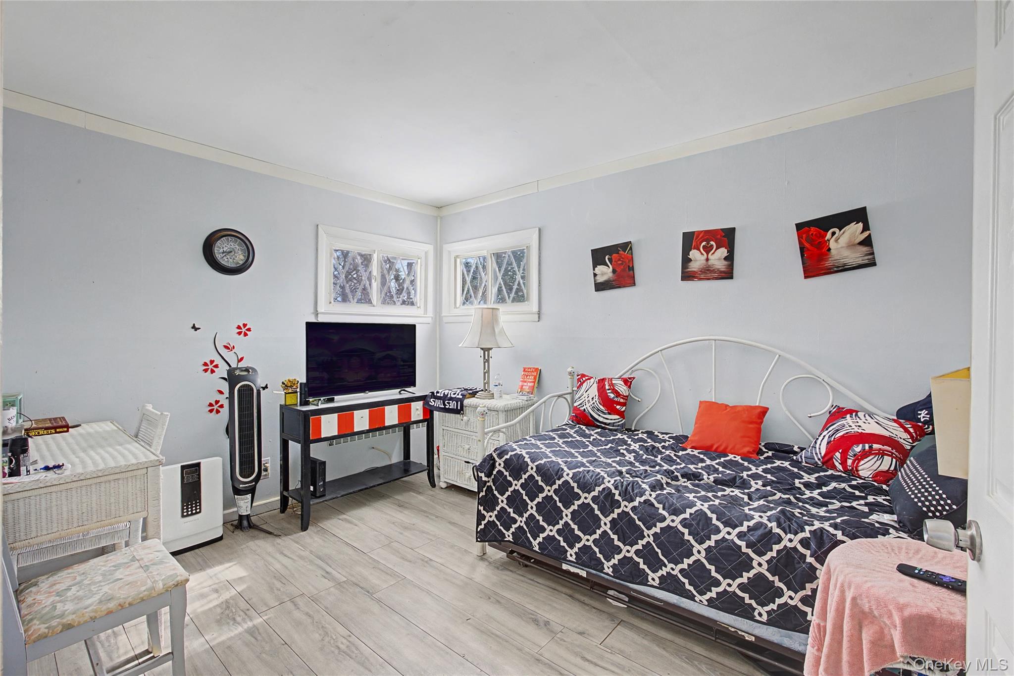 9 Amherst Road West Sayville, NY 11796 - Photo 8 of 22 a bedroom with a bed and a flat screen tv