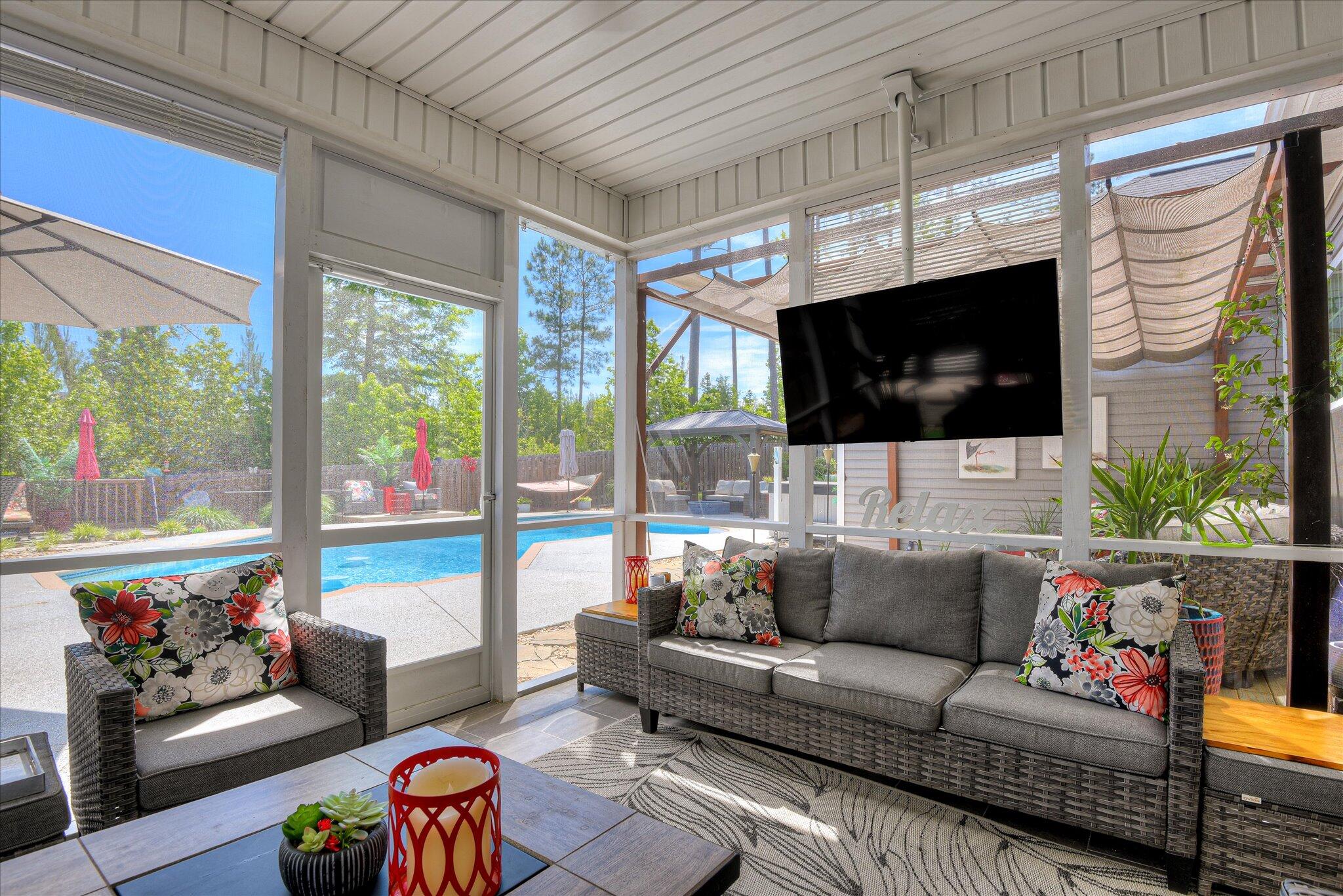 3118 Ridgefield Drive Grovetown, GA 30813 - Photo 51 of 67 Screened in patio comes with a TV.