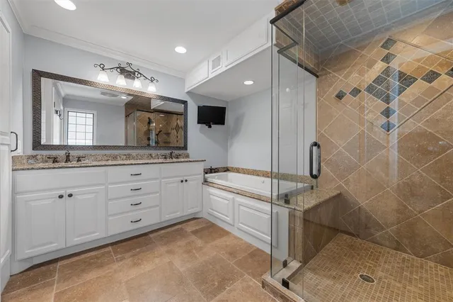 a spacious bathroom with a granite countertop sink mirror and