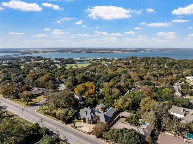 an aerial view of a house with a yard and garden