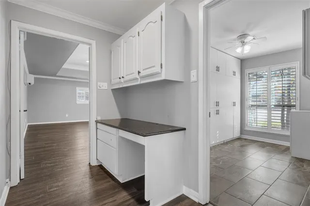 a kitchen with granite countertop a stove and a refrigerator