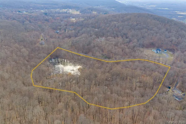 a view of small space with wooden fence