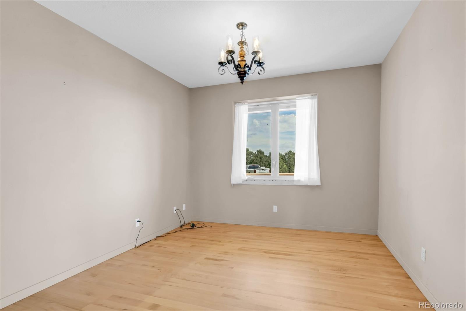 692 Sunrise Ridge Cotopaxi, CO 81223 - Photo 15 of 50 wooden floor in an empty room with a window