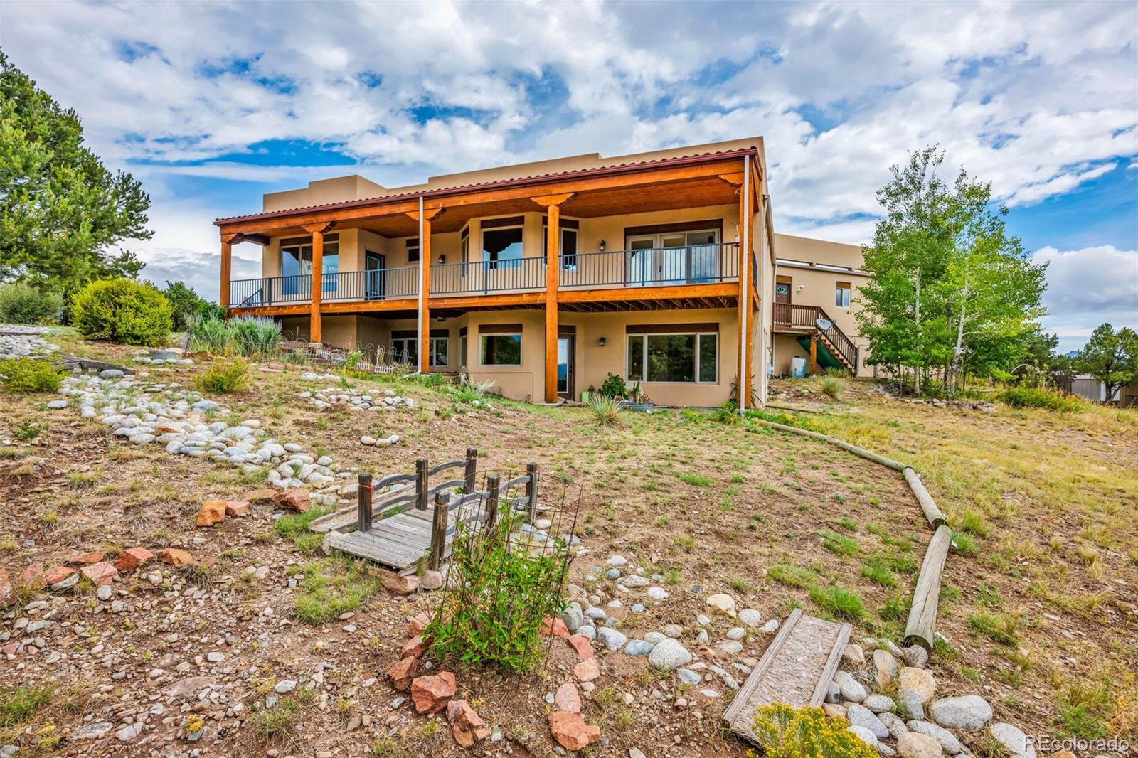 692 Sunrise Ridge Cotopaxi, CO 81223 - Photo 39 of 50 a front view of a house with a yard