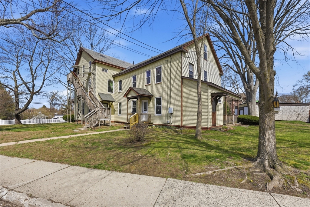 17 Adams Street Easthampton, MA 01027 - Photo 1 of 24 a front view of a house with a yard