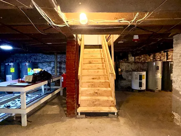 a kitchen with a stove and a refrigerator