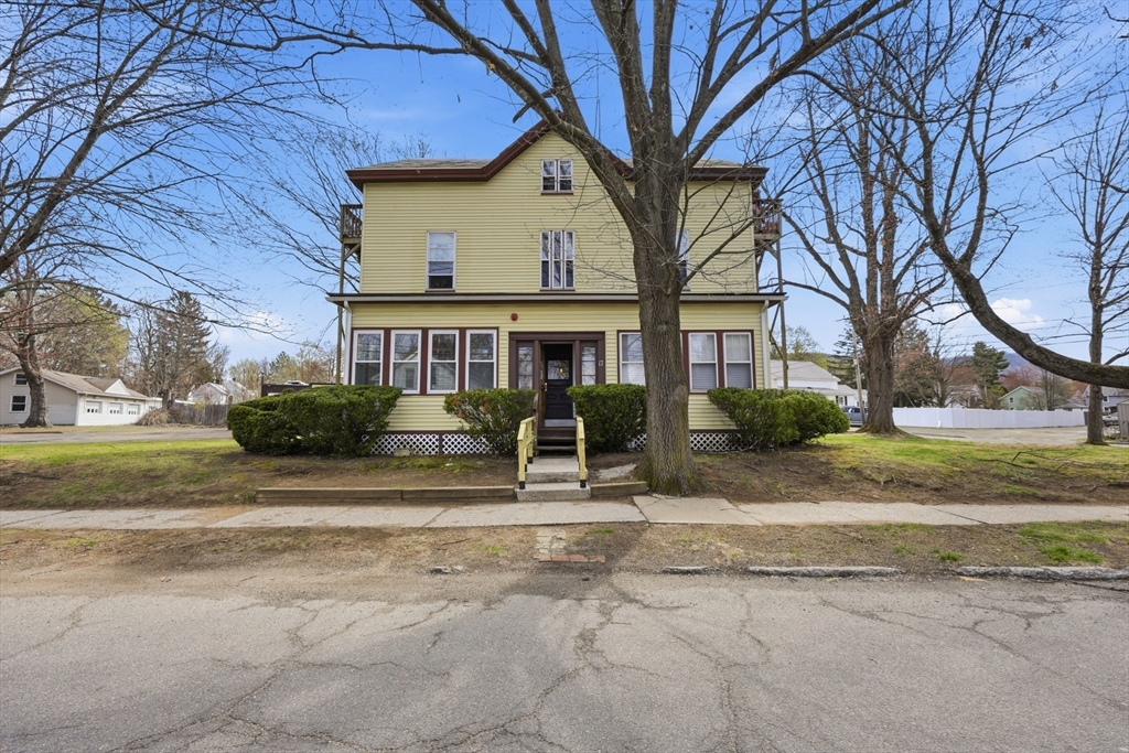 17 Adams Street Easthampton, MA 01027 - Photo 2 of 24 a view of a house with a yard and pathway