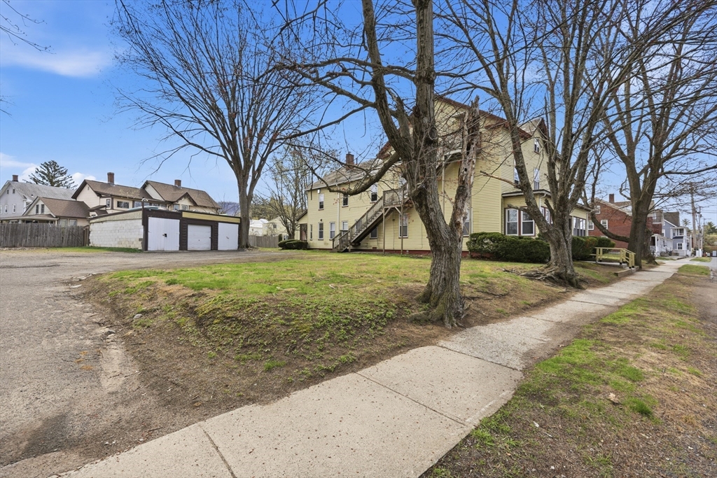 17 Adams Street Easthampton, MA 01027 - Photo 4 of 24 a view of a house with a yard