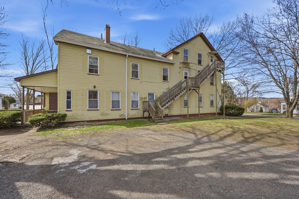 17 Adams Street Easthampton, MA 01027 - Photo 10 of 24 a view of a house with a yard and large tree