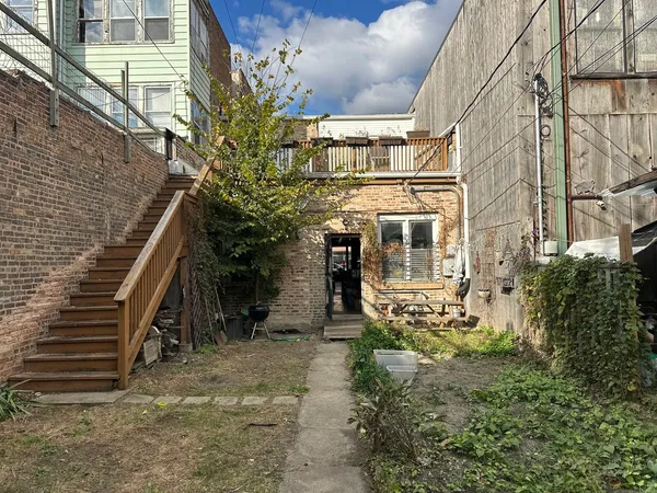 a view of a house with a tree