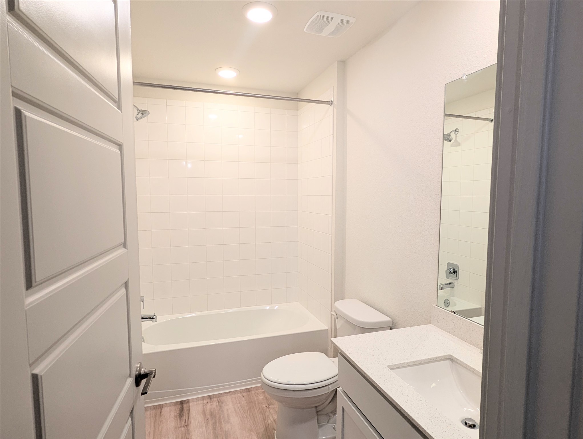 261 Century Plant Road Leander, TX 78641 - Photo 15 of 25 A well-appointed bathroom features a tub, shower, and a vanity with a sleek countertop.