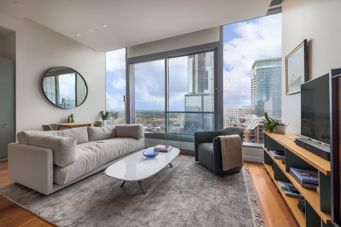 a living room with furniture and a flat screen tv