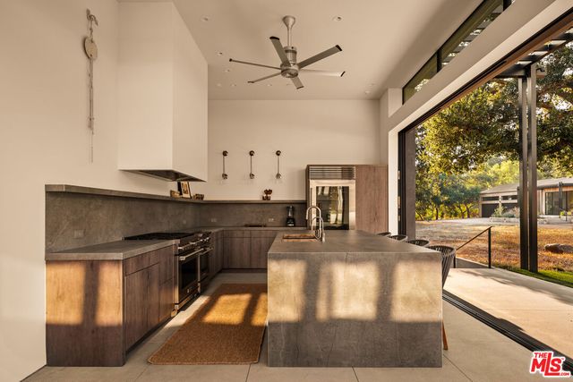a view of a dining room with furniture window and outdoor view