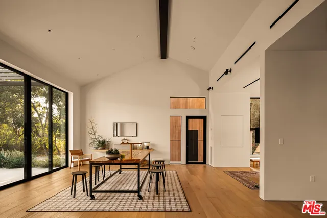 a view of swimming pool with outdoor seating and a garden