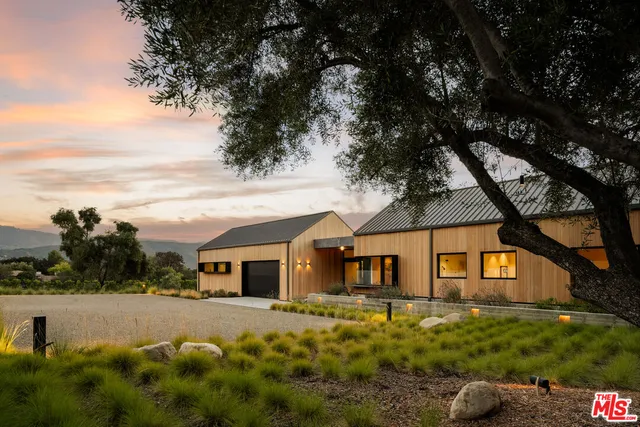 a swimming pool view with a seating space