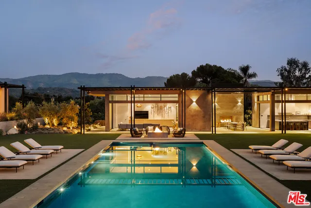 an aerial view of residential houses with city view