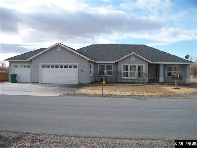 4891 Rancheria Road Fallon, NV 89406 - Photo 1 of 13 a front view of a house with a yard