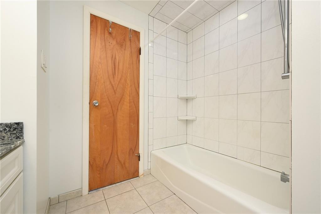 1608 Seegar Road Pittsburgh, PA 15241 - Photo 15 of 23 a white bath tub sitting next to a white wall