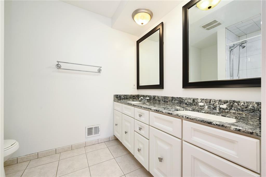 1608 Seegar Road Pittsburgh, PA 15241 - Photo 16 of 23 a bathroom with a sink a toilet and mirror