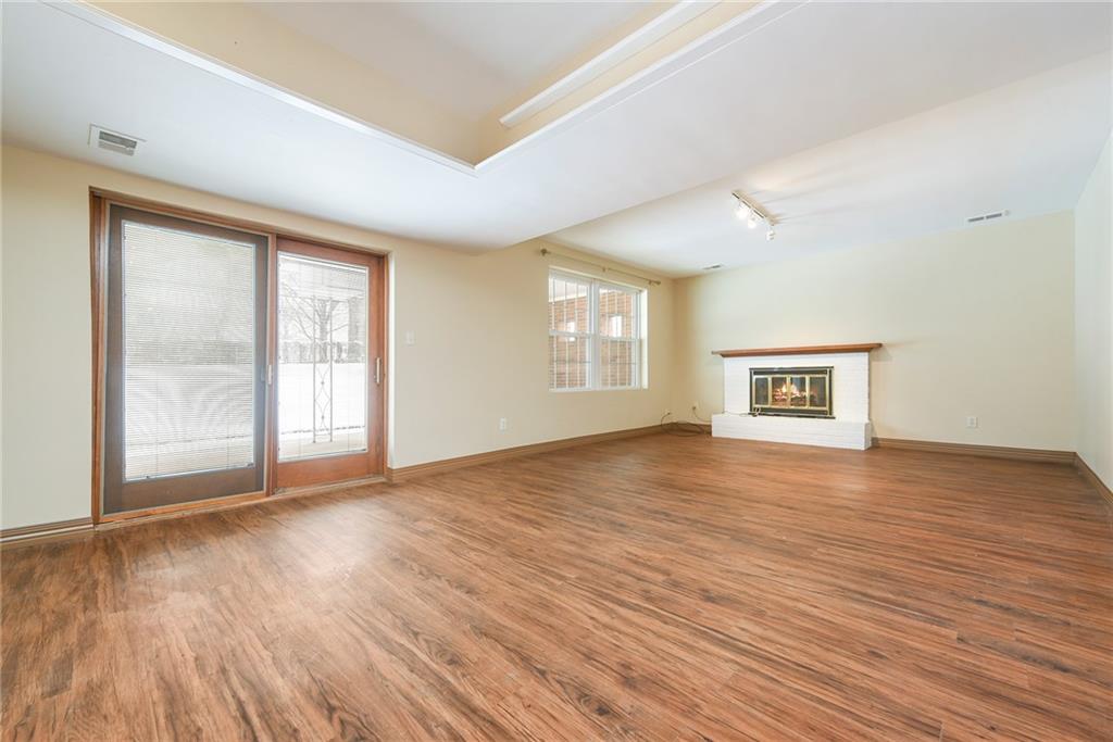 1608 Seegar Road Pittsburgh, PA 15241 - Photo 18 of 23 an empty room with wooden floor and windows