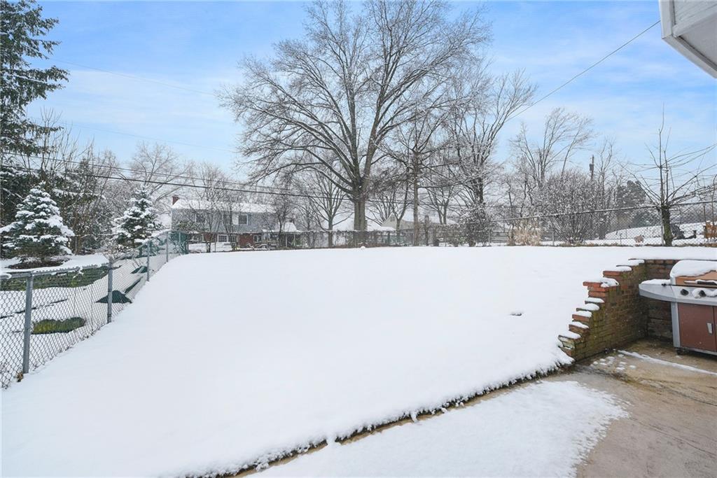 1608 Seegar Road Pittsburgh, PA 15241 - Photo 23 of 23 a view of a yard covered in snow