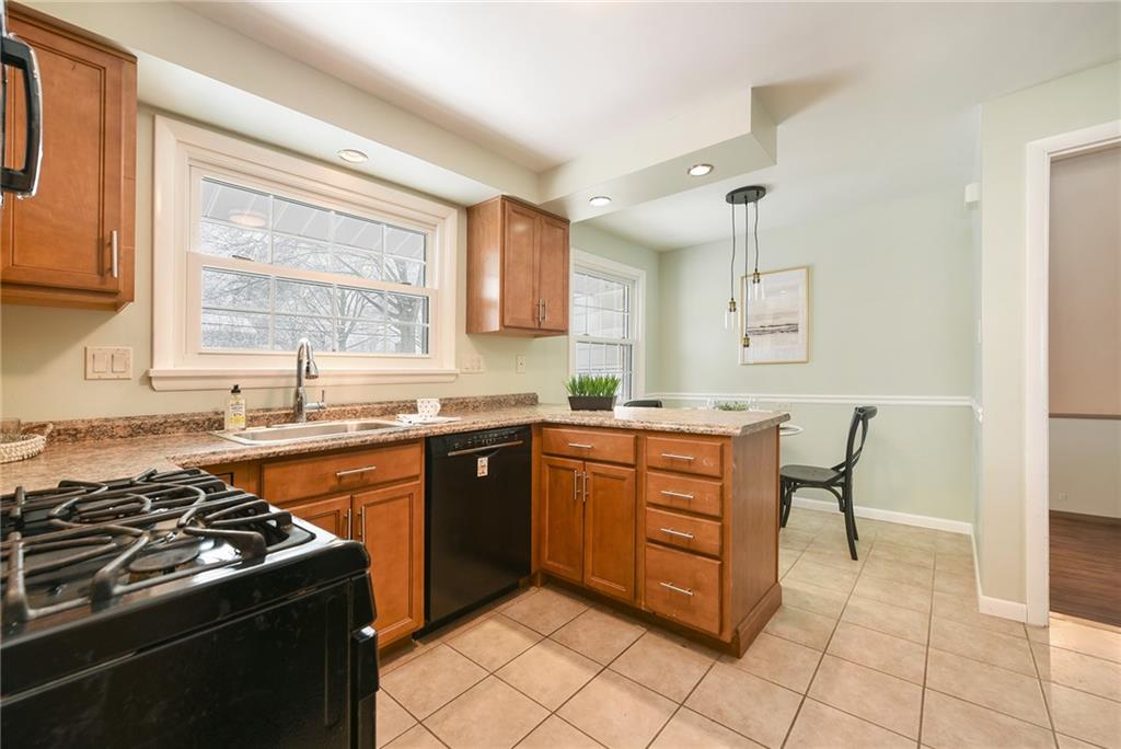 1608 Seegar Road Pittsburgh, PA 15241 - Photo 7 of 23 a kitchen with stainless steel appliances granite countertop a stove a sink and a microwave