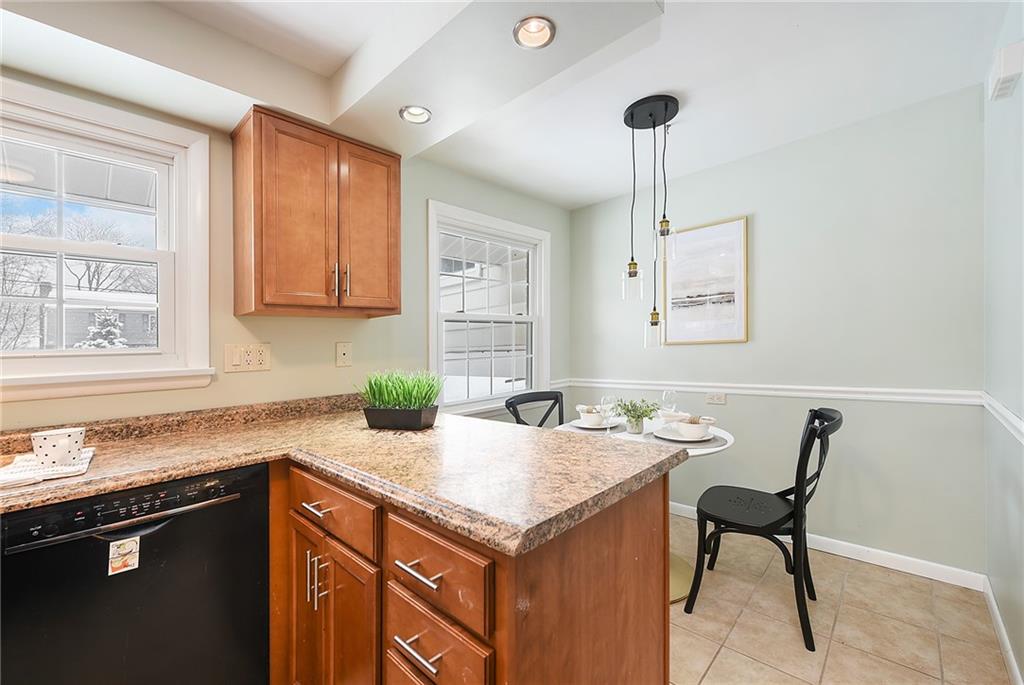 1608 Seegar Road Pittsburgh, PA 15241 - Photo 9 of 23 a kitchen with a cabinets and chairs