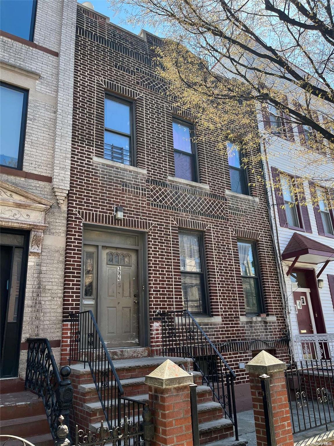 386 Bleecker Street Brooklyn, NY 11237 - Photo 1 of 1 a front view of a building with glass windows