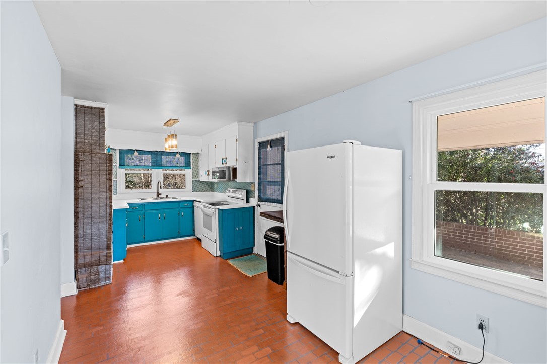 420 Brock Street Central, SC 29630 - Photo 11 of 45 This kitchen offers a cheerful ambiance, complete with ample counter space and storage.